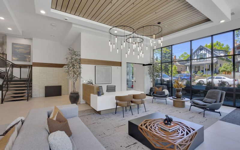a room with a couch and chairs