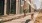 Man walking dog on sidewalk